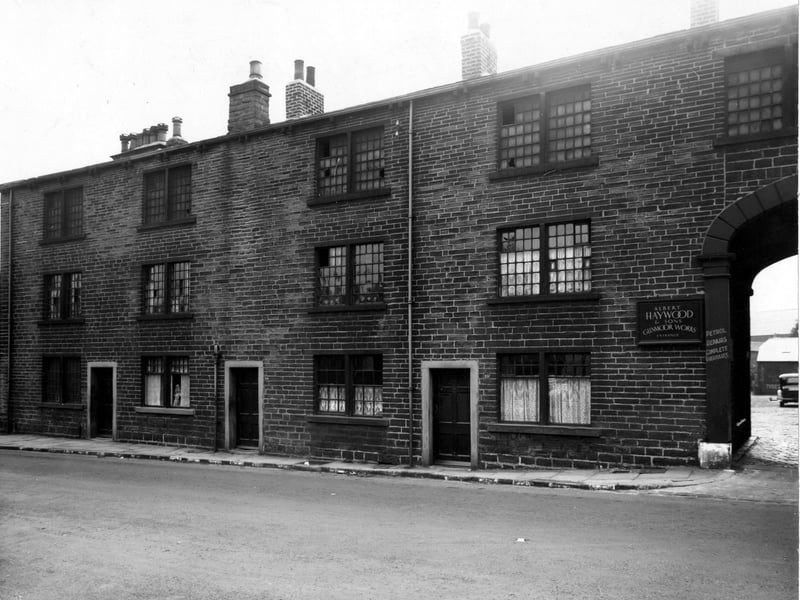 Town Street with Glenmoor Garage, owned by A. Haywood and Sons, on the right. A car is visible through the archway. Pictured in September 1947.