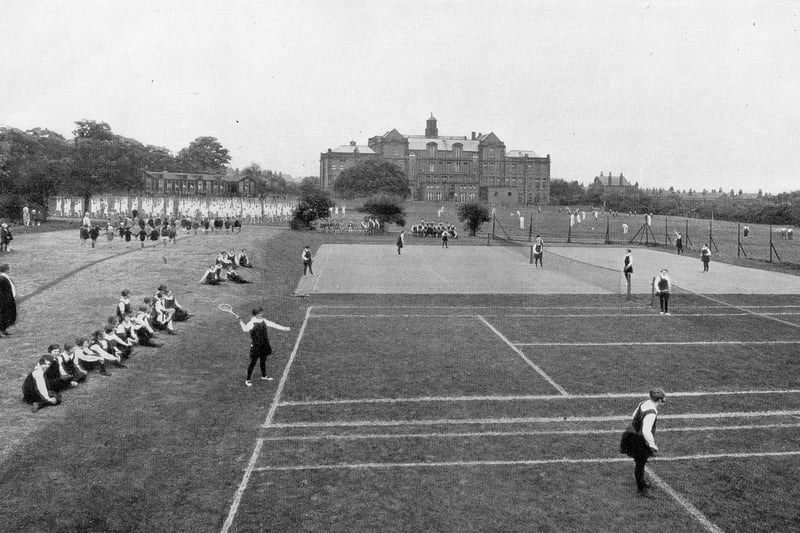 The sports fields behind the old building of West Leeds High School, looking north circa 1940s. A variety of sports activities are taking place. To the left of the buildings can be seen the wooden buildings that housed the kindergarten. The area is now occupied by housing on College Lawns and College View.