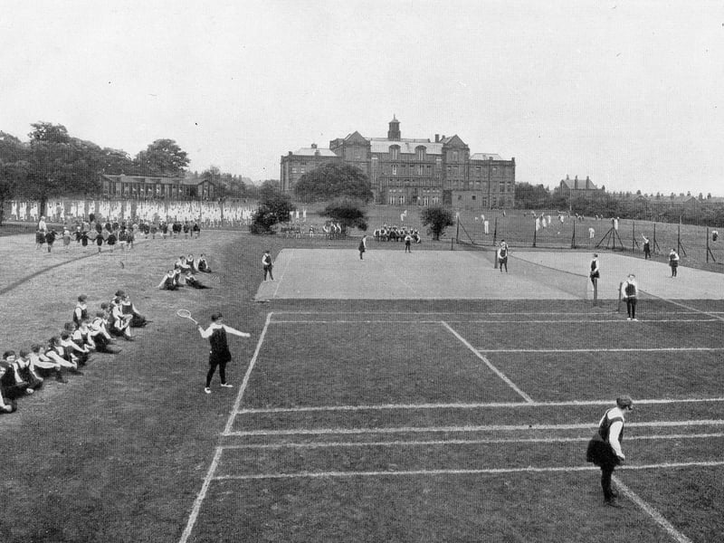 The sports fields behind the old building of West Leeds High School, looking north circa 1940s. A variety of sports activities are taking place. To the left of the buildings can be seen the wooden buildings that housed the kindergarten. The area is now occupied by housing on College Lawns and College View.