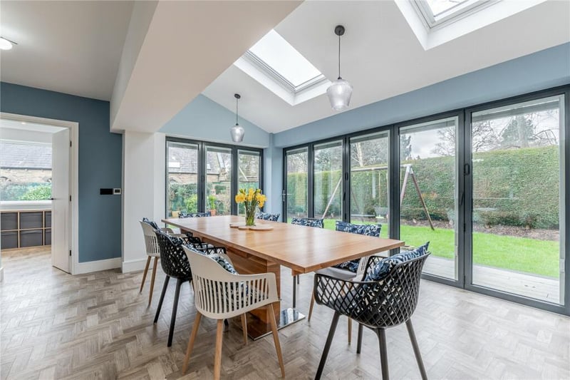 It opens up to this beautiful dining area with bi-folding doors and skylights.