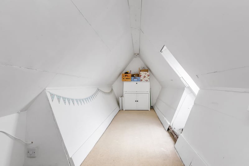 The attic space is floored and spacious with a recessed window, with the potential for useful development opportunities after seeking relevant planning permissions.