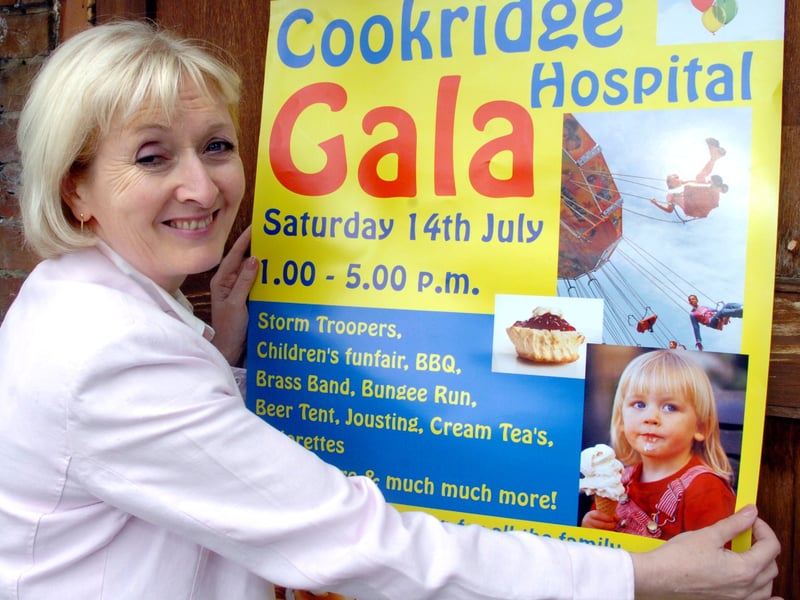 Julky 2007 and Sheila O'Shea puts up a poster to promote Cookridge Hospital Gala.