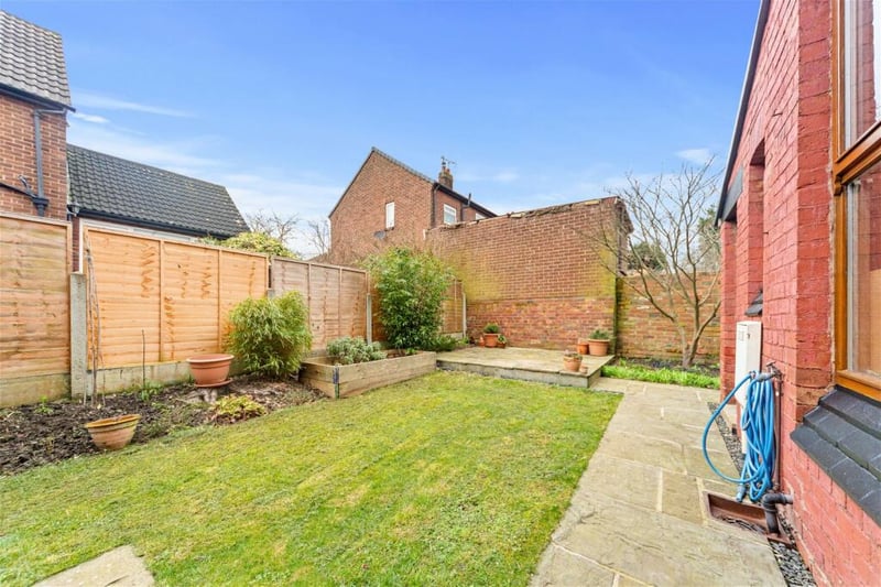 The rear garden is an enticing, well designed space ideal for summer barbecues.