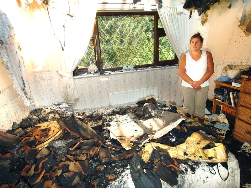 Cookridge resident Cherry Dabill is pictured in the bedroom of her house in July 2006 after it was struck by lightning.
