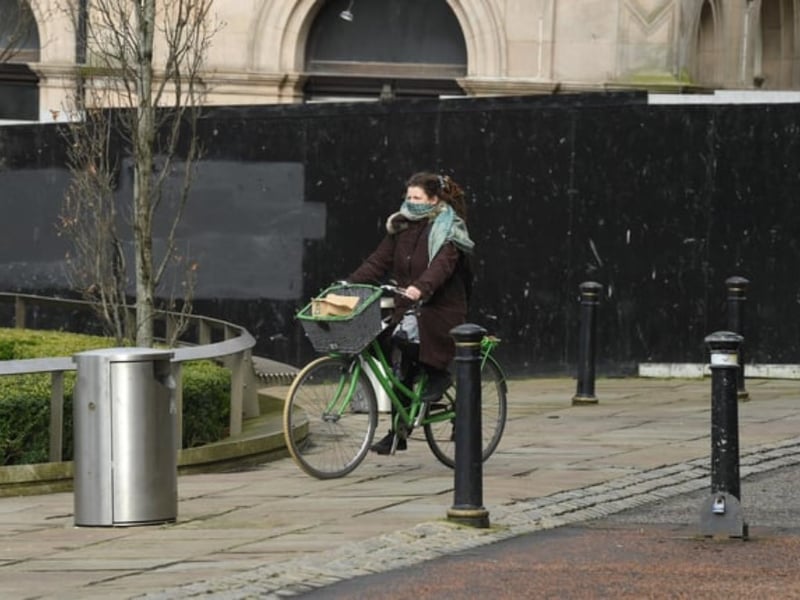 Exercising was permitted during the lockdown and this cyclist was taking no chances - keeping her face covered with a scarf