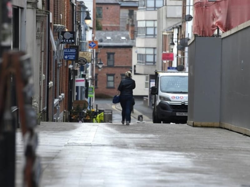 A sole walker heads down Cannon Streett off Fishergate