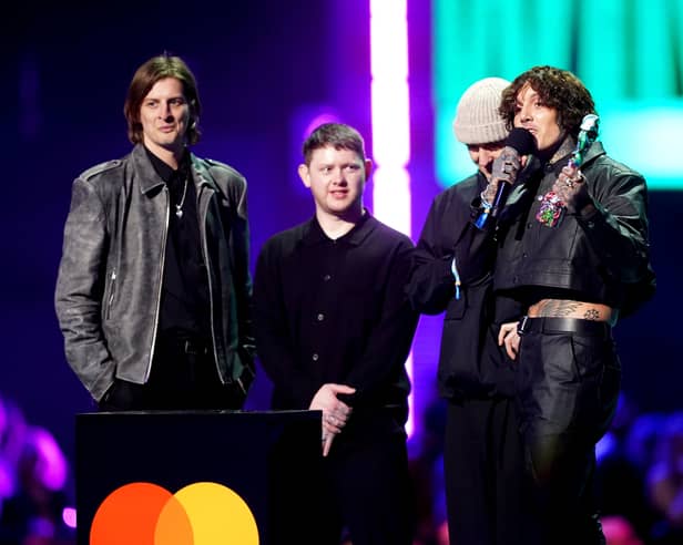 Matt Kean, Lee Malia, Oliver Sykes and Mat Nicholls of Bring Me The Horizon on stage after winning the award for Best Alternative / Rock Act during the Brit Awards 2024 at the O2 Arena, London. Photo: James Manning/PA Wire