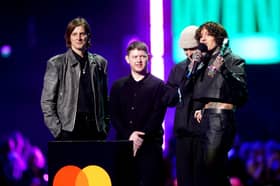 Matt Kean, Lee Malia, Oliver Sykes and Mat Nicholls of Bring Me The Horizon on stage after winning the award for Best Alternative / Rock Act during the Brit Awards 2024 at the O2 Arena, London. Photo: James Manning/PA Wire