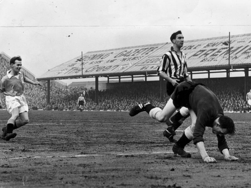 Ernie Taylor grins with delight as he lifts the ball over centre half Stokoe and goalkeeper Simpson to score Blackpool's first goal against Newcastle at Bloomfield Road in 1956
