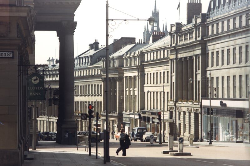  A view of Grey Street Newcastle upon Tyne taken c.1978. The photograph has been taken from Hood Street looking down Grey Street. Lloyds Bank is in the foreground to the left with Market Street beyond then the portico of the Theatre Royal. The Royal Turks Head Hotel is in the centre to the right. The spire of St Nicholas Cathedral can be seen in the background.