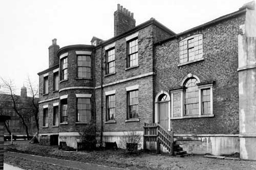 Burton Lodge, a large Georgian House on Burton Avenue, off Dewsbury Road. Cockburn High School can be seen on the left. Pictured in November 1950. 