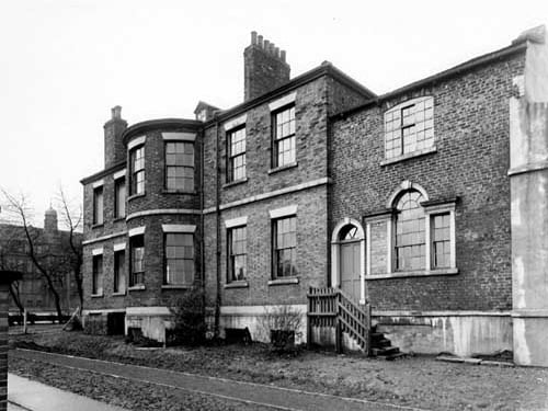 Burton Lodge, a large Georgian House on Burton Avenue, off Dewsbury Road. Cockburn High School can be seen on the left. Pictured in November 1950.