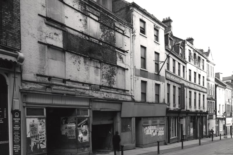 A view of the Cloth Market Newcastle upon Tyne taken in 1979. The photograph shows the left-hand side of the Cloth Market. Several of the buildings in the foreground to the left are boarded up.