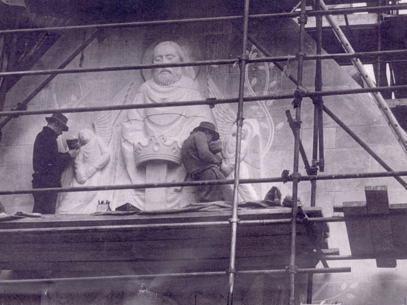 Stone Sculptors at work on the exterior of the chapel of Our Lady of Lourdes, in 1956