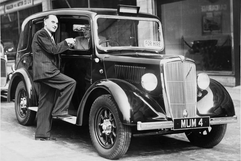 This London type taxi was on service in Leeds in July 1949. With its high body and cut away luggage comaprtment, it is said to be more immediately recognisable as a taxi than other Leeds taxis. This attribute, it is hoped, will reduce "dead" mileage.