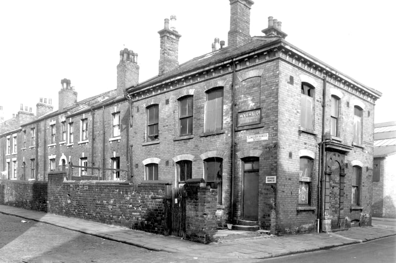 This view looks from Bridge Street onto properties on Lower Brunswick Street. Numbers run from the left in ascending order to number 37 in the centre. On the right is a large commercial property which is now disused. This had been Brunswick Cottage facing onto Bridge Street although this entrance has been bricked up. The property had been used by Myers and Co, furriers and the Melbourne Cabinet Co.