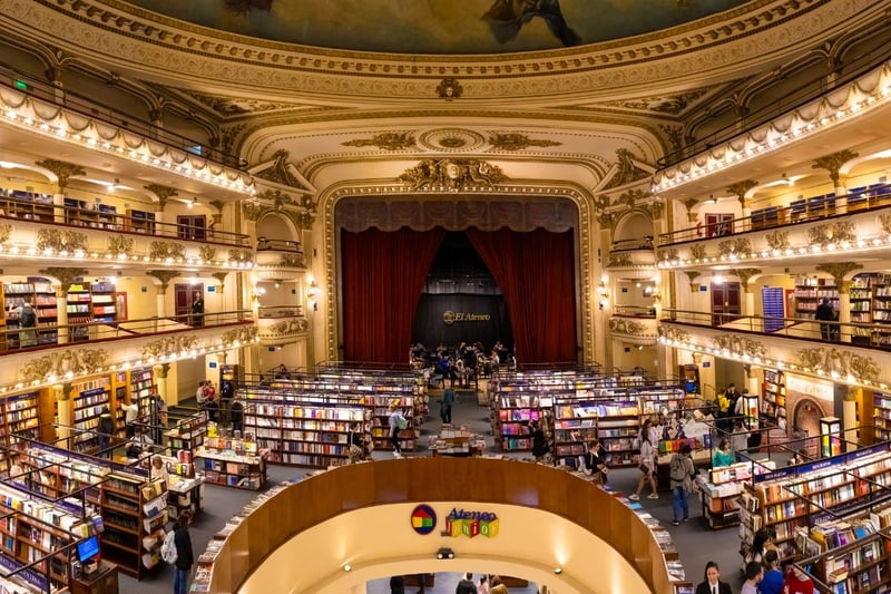 Originally a 1,000+ capacity theatre with a hugely ornate interior featuring ceiling frescoes painted by the Italian artist Nazareno Orlandi, it was converted into a huge book and music shop. Customers can sit in the original theatre boxes, while the stage area is now a cafe.