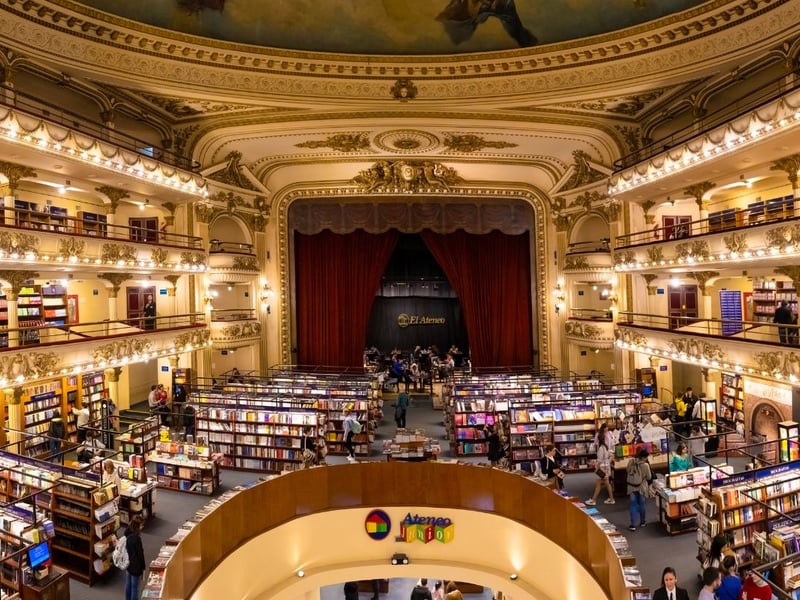 Originally a 1,000+ capacity theatre with a hugely ornate interior featuring ceiling frescoes painted by the Italian artist Nazareno Orlandi, it was converted into a huge book and music shop. Customers can sit in the original theatre boxes, while the stage area is now a cafe.