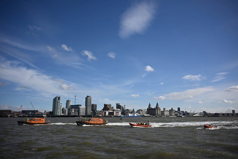 With the Liverpool skyline in the background, Royal National Lifeboat Institution (RNLI) lifeboats from Lytham St Annes, Hoylake, New Brighton and West Kirby form a flotilla in the River Mersey to celebrate the 200th anniversary of the association.