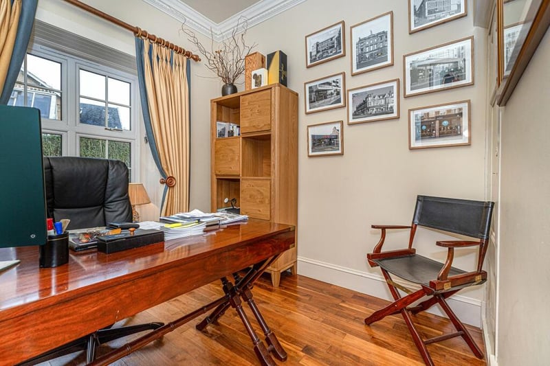 The home office is the perfect study space which features walnut flooring. 