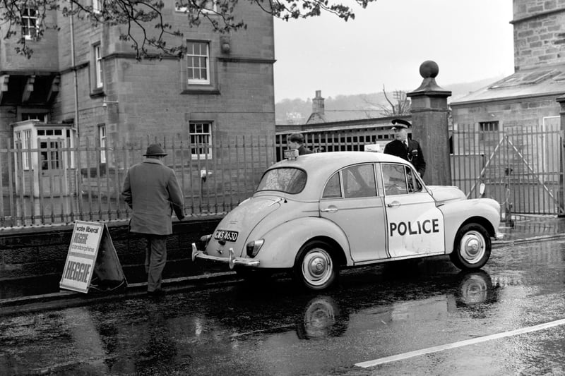 A Morris Minor police panda car sits outside the polling station at Corstorphine primary school in May 1969