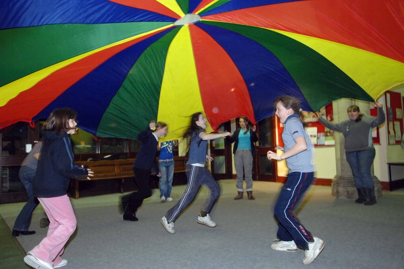 Girl Guides from the 1st Armley (Christ church) Guides are pictured having fun with a parachute in the Christ Church Hall in November 2007.