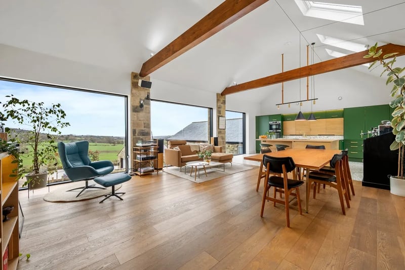 The open plan kitchen/living features bespoke picture windows to the front elevation boasting fabulous open field views.