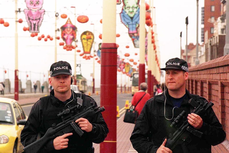 An armed Police Security Patrol ahead of a Conservative Party Conference. Photo John Giles.PA.