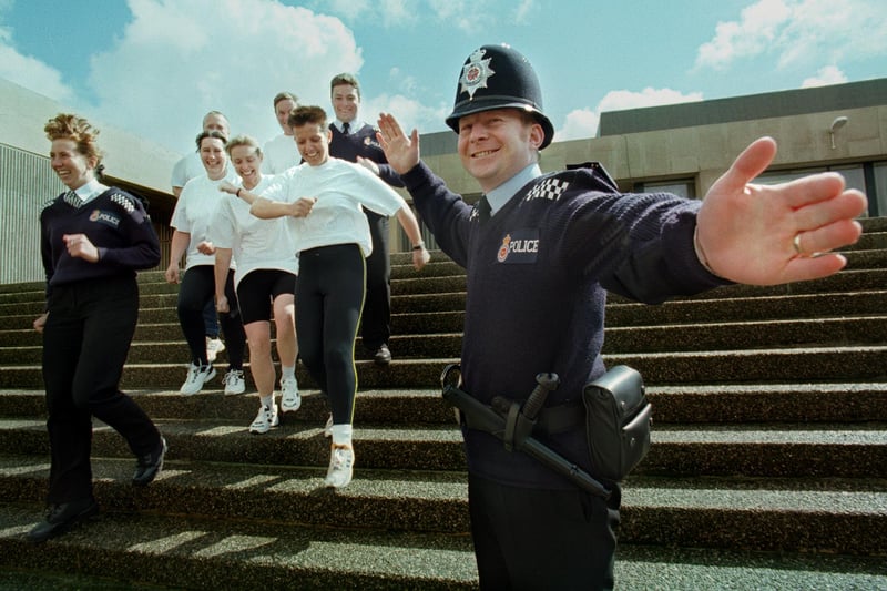 PC Terry Hardy directs colleagues from the training unit at Blackpool Police Station on their way to the 10km Fun Run
