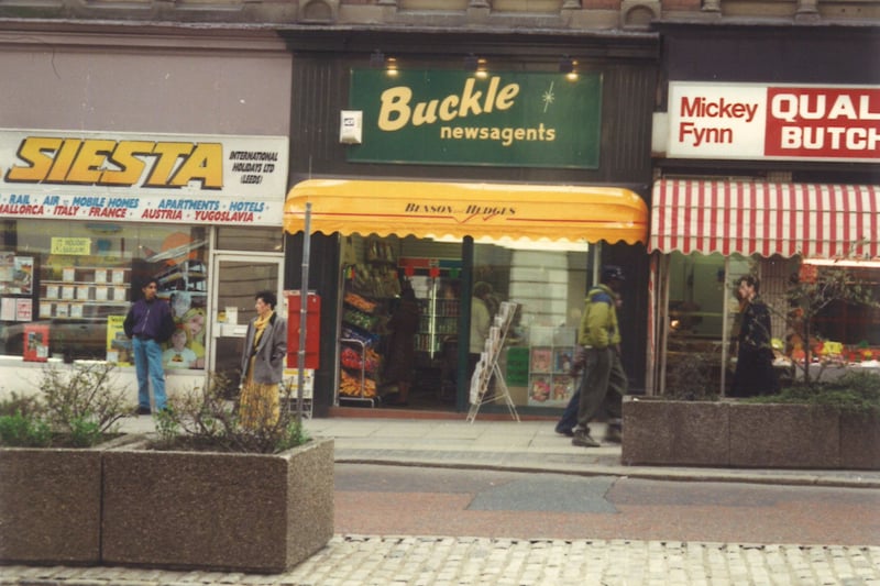 Shops on the south side of The Headrow in August 1991. Pictured, from left, are Siesta Holidays, then Buckle newsagents and Mickey Fynn butchers.