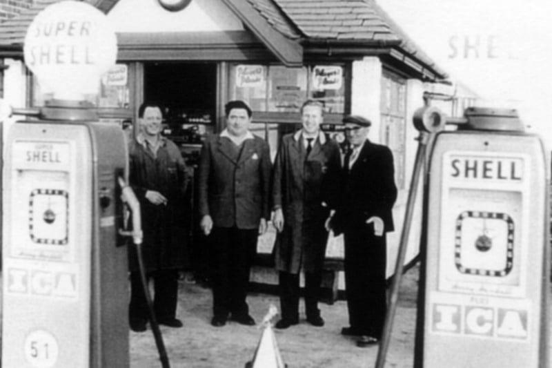 The sales kiosk at Ball's Garage when petrol was 25p per gallon. On the left is part-time sales assistant Ronnie Anyon whose brother Tommy looked after motor cycles at Ball's. Next to him is part-timer George Reeder and then mechanic Joe Crossley. The man on the right is unknown