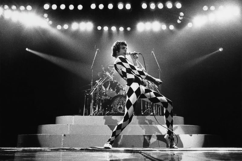 The iconic singer Freddie Mercury of rock group Queen onstage during a 1978 concert that took place in Inglewood, California