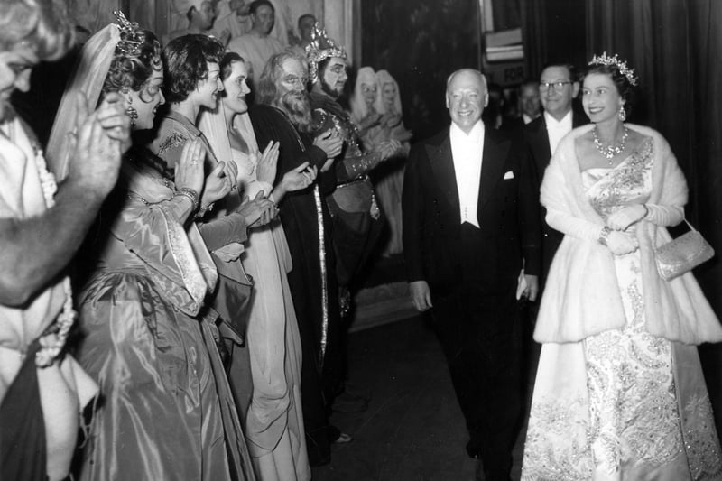 HM Queen Elizabeth II, accompanied by Mr D. L. Webster, and by Mr J. Lyons, Chairman of the Executive Committee of the Leeds Triennial Musical Festival, meeting members of the cast of Handel's opera "Samson" at the Grand Theatre, as part of the centenary celebrations of the Musical Festival. Pictured in October 1958.