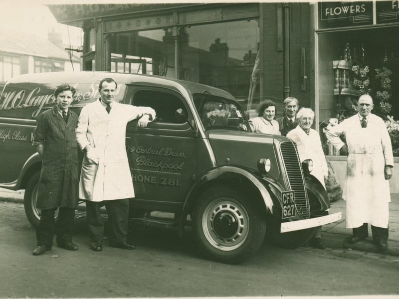 A young Winnie Laycock, fourth right, outside the family florist shop at the corner of Central Drive and Princess Street