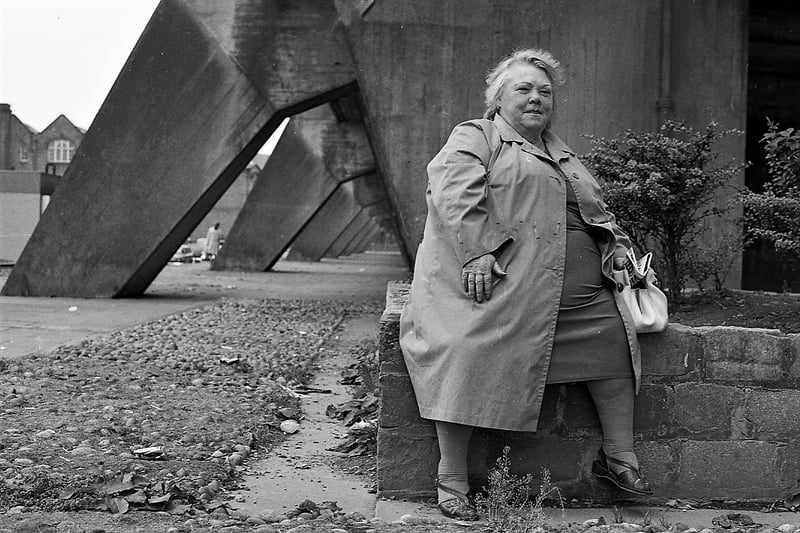 A woman captured on Queen Elizabeth Square in the Gorbals in the eighties. 