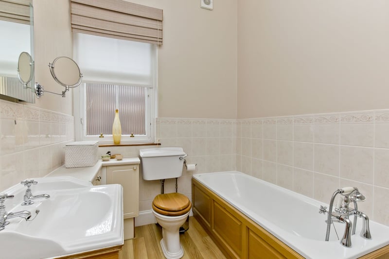 On the first floor, the four-piece family bathroom has a similar aesthetic. It is equipped with a washbasin, a toilet, a shower cubicle, and a bath with a handheld shower.
The property has gas central heating controlled by a programmable four-channel time switch. It is also predominantly fitted with traditional sash- and-case windows, which ensure a light and airy ambience throughout the day.