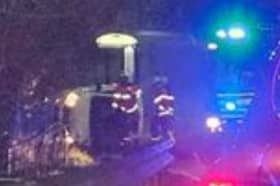 Picture shows a car on its side as firefighters attend the crash on Gleadless Road, Sheffield. Picture: Cameron Lane