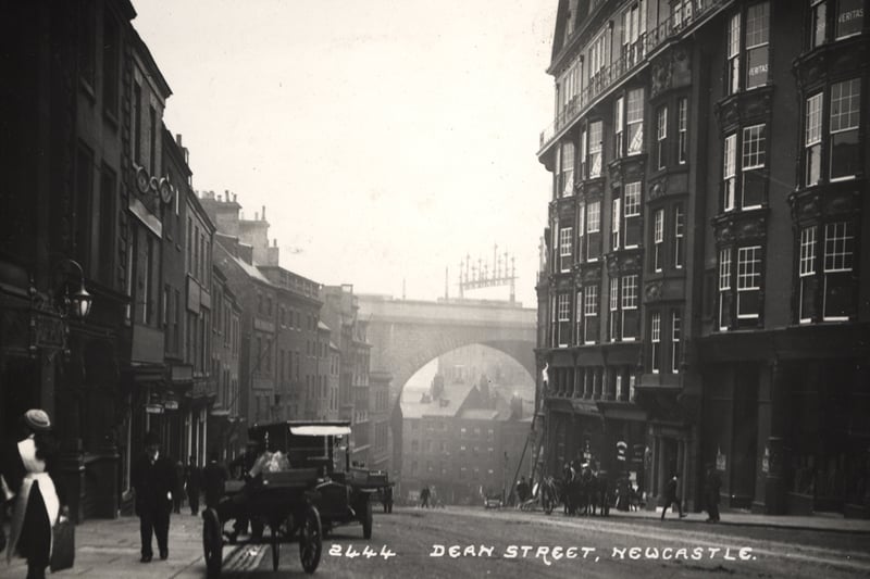 This is a photograph of Dean street looking down towards the railway bridge. On the right hand side is the Cathedral buildings which were mainly occupied by the colliery companies.