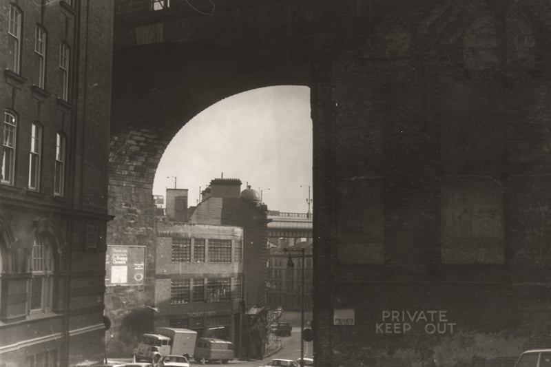 A view of the Side Newcastle upon Tyne taken c.1970. The photograph is looking down the Side. Dean Street is to the left and the railway bridge in the centre. The Tyne Bridge can be seen in the background. 