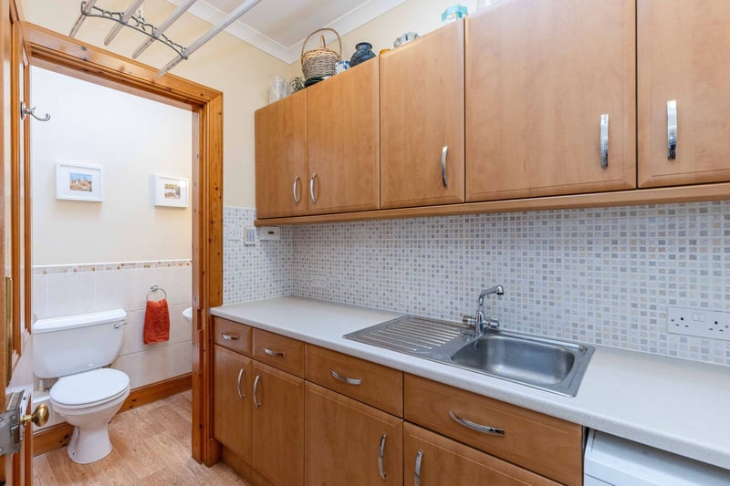 The handy utility room and downstairs toilet. The kitchen appliances are included in the sale. Other items may be available through separate negotiation.