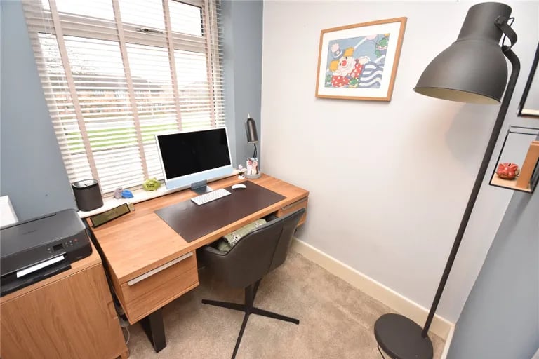 The third bedroom is a 
smaller single room currently currently used as an office.