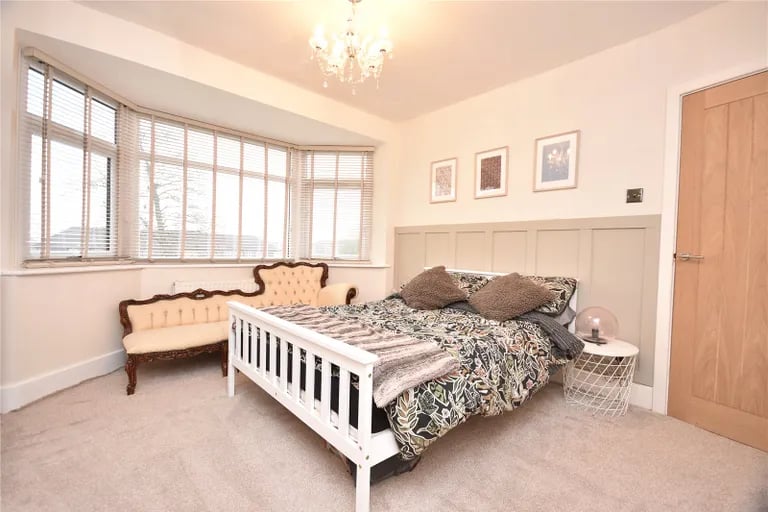 On the first floor are two spacious double bedrooms, this one with a bay window.