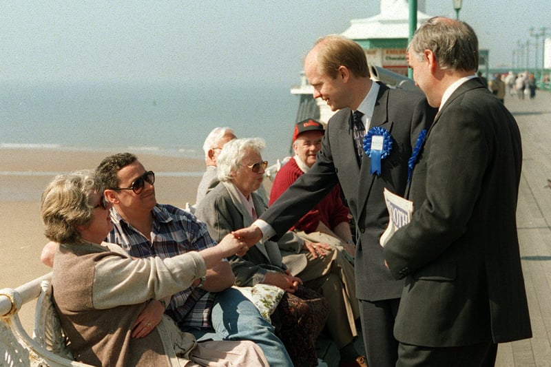 William Hague and Blackpool South candidate Richard Booth (right) chatting to holidaymakers on North Pier