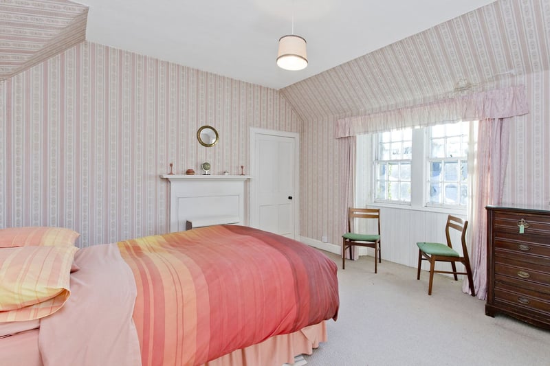 The property has three well-proportioned double bedrooms, with the smallest featuring an en-suite.