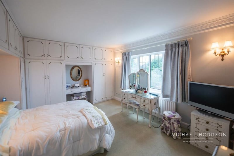 The property features four bedrooms, all of which include fitted wardrobes.