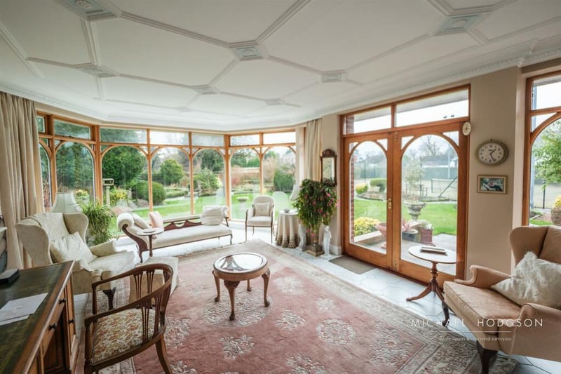At the rear of the property, there is a garden room which offers great views of the home's extensive garden area.