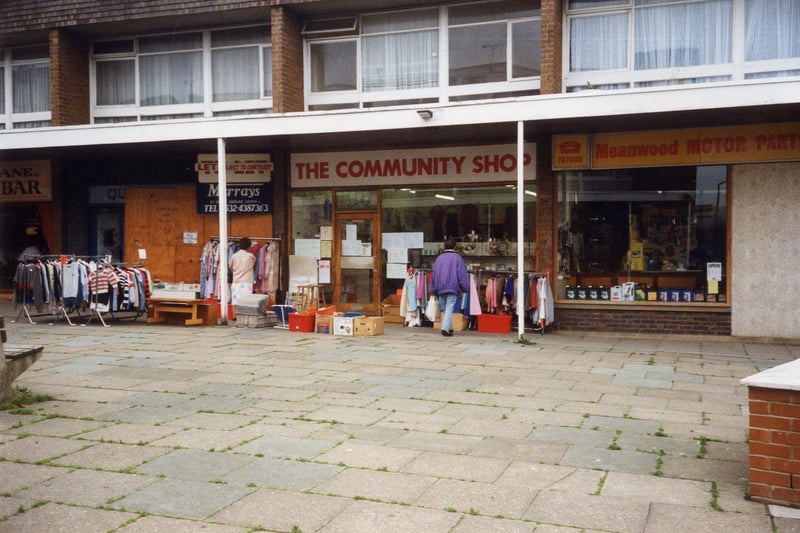 A parade of shops on Green Road in  June 1992. No. 12 on the right is Meanwood Motor Parts and no. 14 in the centre The Community Shop, while on the left is an empty shop at no 16.