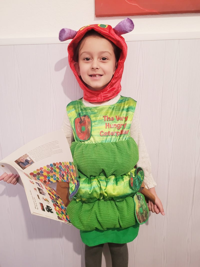 Erica, 6 years old, dressed up as The Very Hungry Caterpillar.