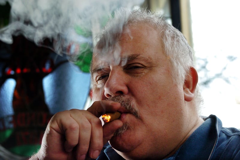 Licensee Martyn Goulding enjoys a smoke in his pub in February 2007.