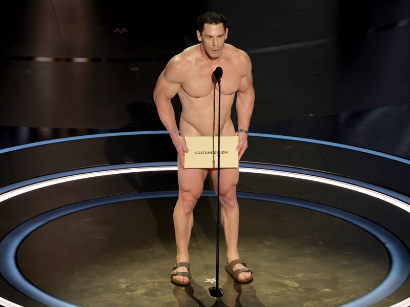 Audiences certainly saw a lot of John Cena during the Oscars, when the wrestler and actor presented the award for Best Costume Design to Holly Waddington for Poor Things naked, in a callback to the 1974 awards. 
